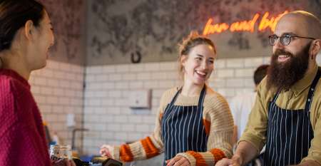 Woman man serving female in restaurant