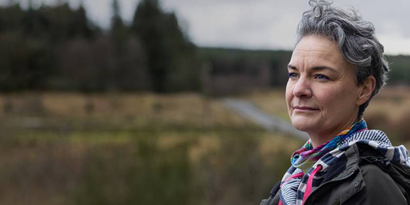 Woman looking over countryside